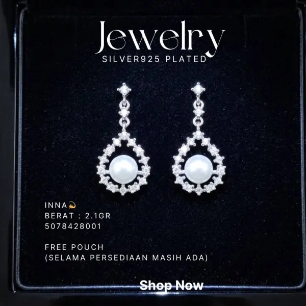 Anting perak 925 model Inna gantung dengan mutiara dan zirkonia di atas latar hitam
