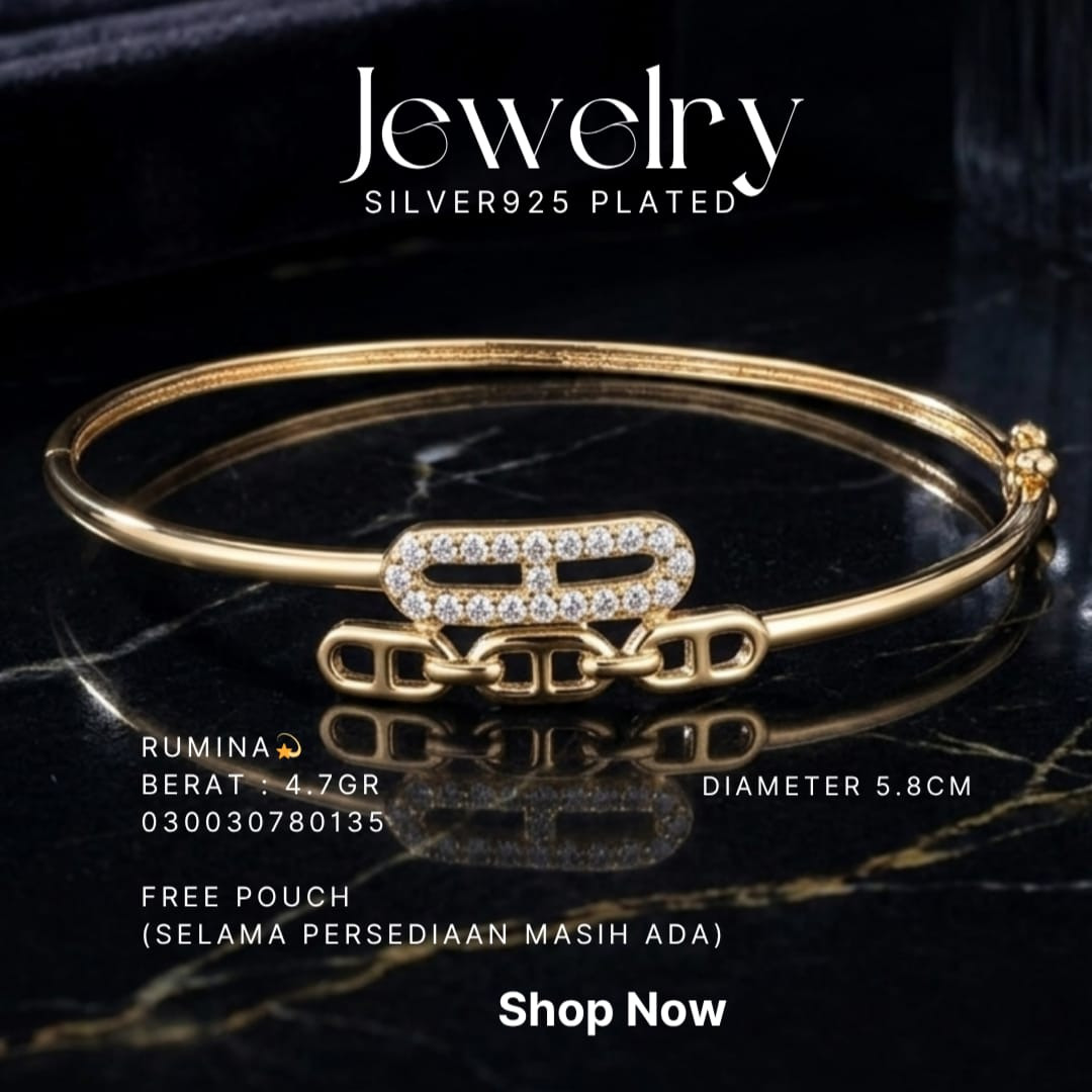 Gelang perak 925 model Rumina bangle warna gold dengan zirkonia dan mata rantai di atas marmer